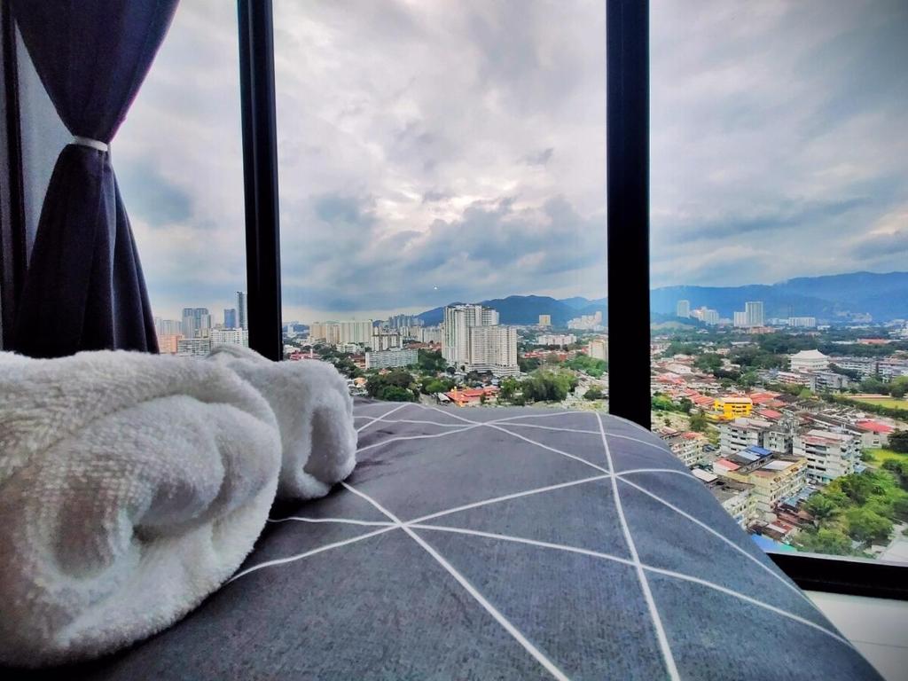 a room with a view of a city from a tower at Luxury Sky Pool 8-Pax City Centre Beacon in George Town