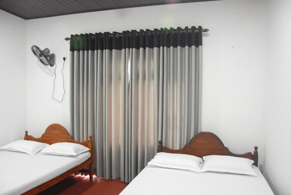 Postel nebo postele na pokoji v ubytování Kulassa Homes