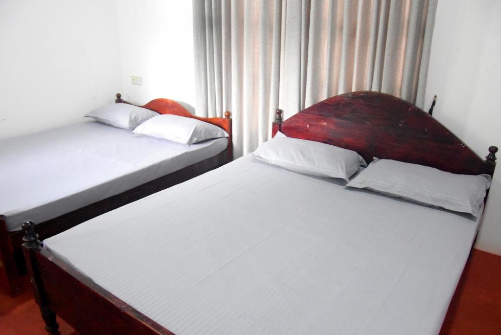 Postel nebo postele na pokoji v ubytování Kulassa Homes