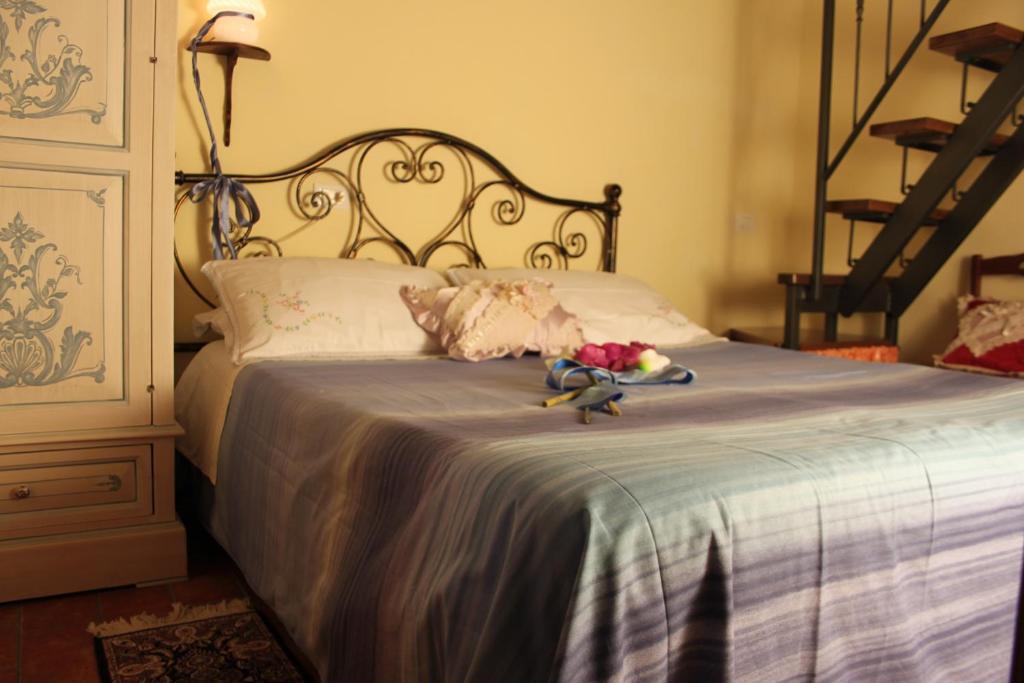 Postel nebo postele na pokoji v ubytování Casa Vacanze Le Antiche Pietre