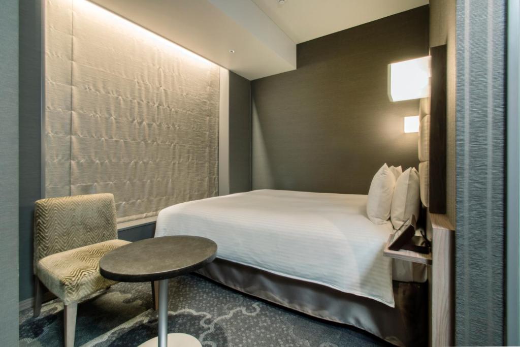 Postel nebo postele na pokoji v ubytování Hotel Keihan Tsukiji Ginza Grande