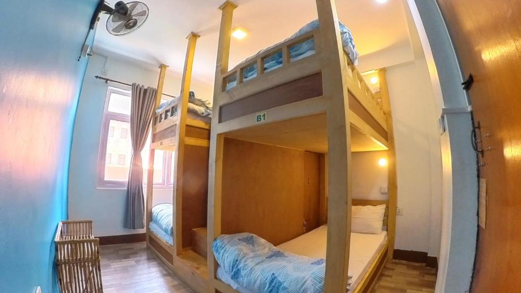 Postel nebo postele na pokoji v ubytování Thamel Hostel & Spa