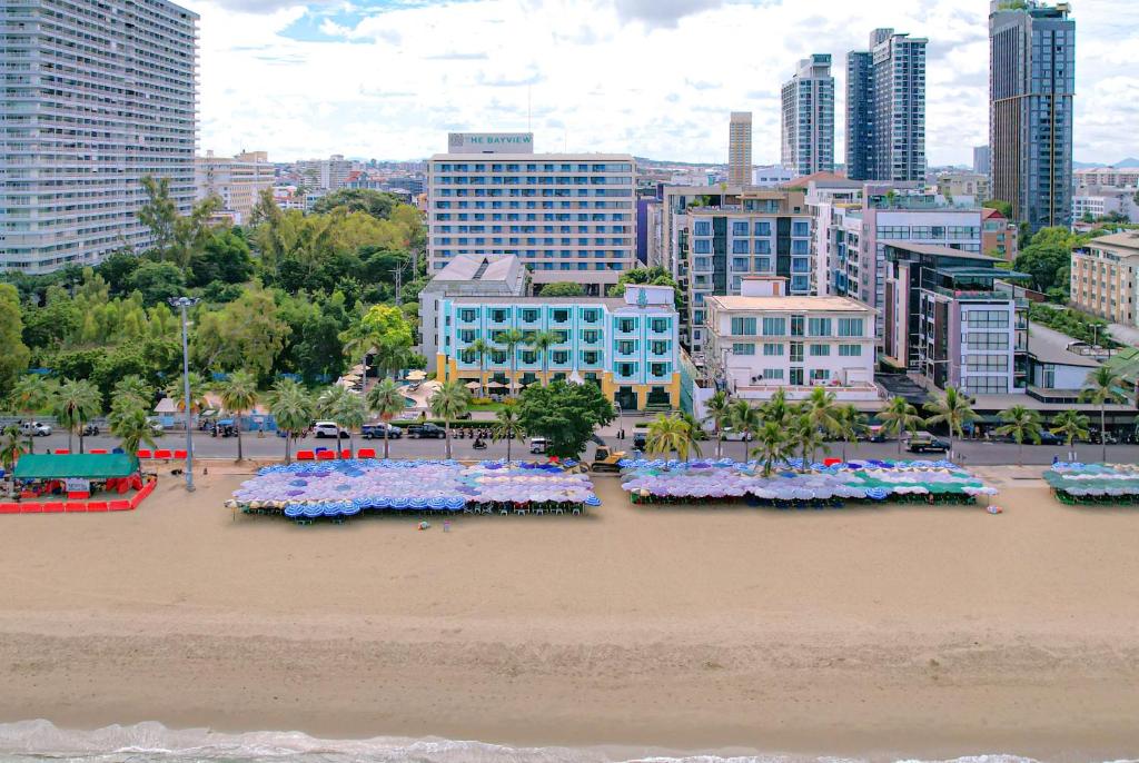a view of a beach with flowers in the sand at Wave Hotel Pattaya in Pattaya