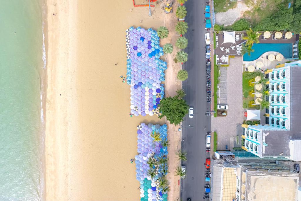 an overhead view of a beach with umbrellas at Wave Hotel Pattaya in Pattaya