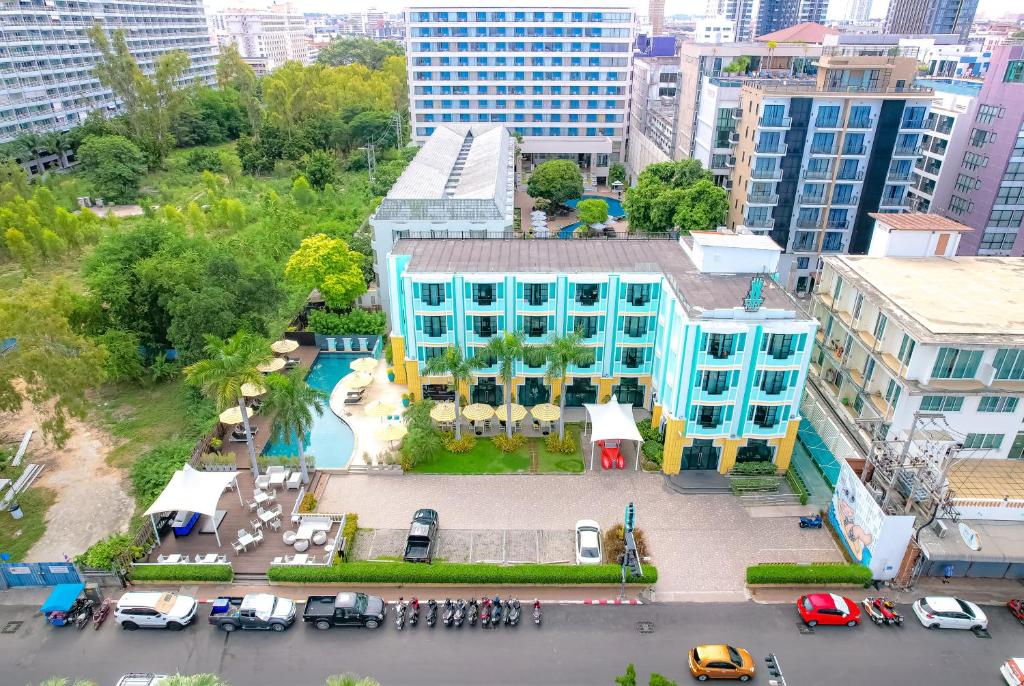 an aerial view of a blue building in a city at Wave Hotel Pattaya in Pattaya