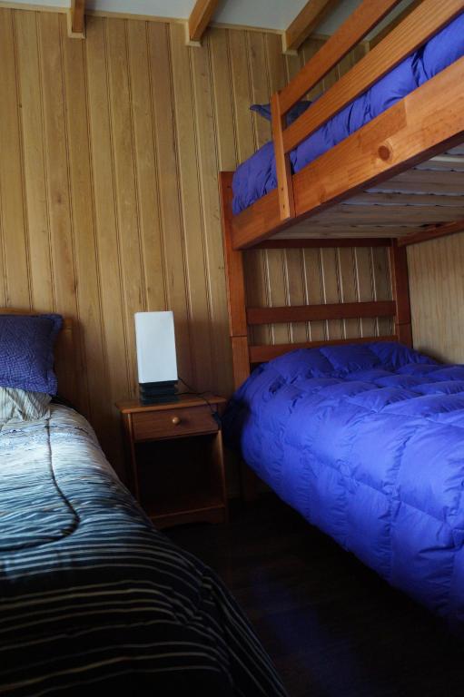Postel nebo postele na pokoji v ubytování Cabañas Vista Tranquila Chiloé