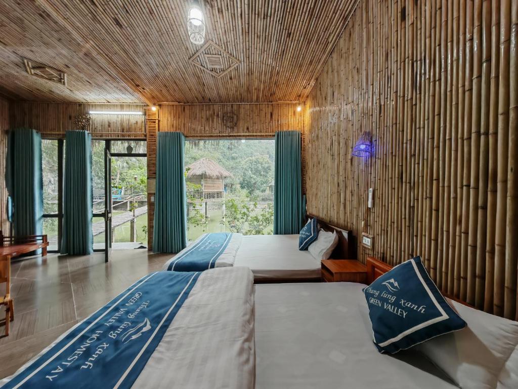 Postel nebo postele na pokoji v ubytování Green Valley Homestay - Thung Lũng Xanh