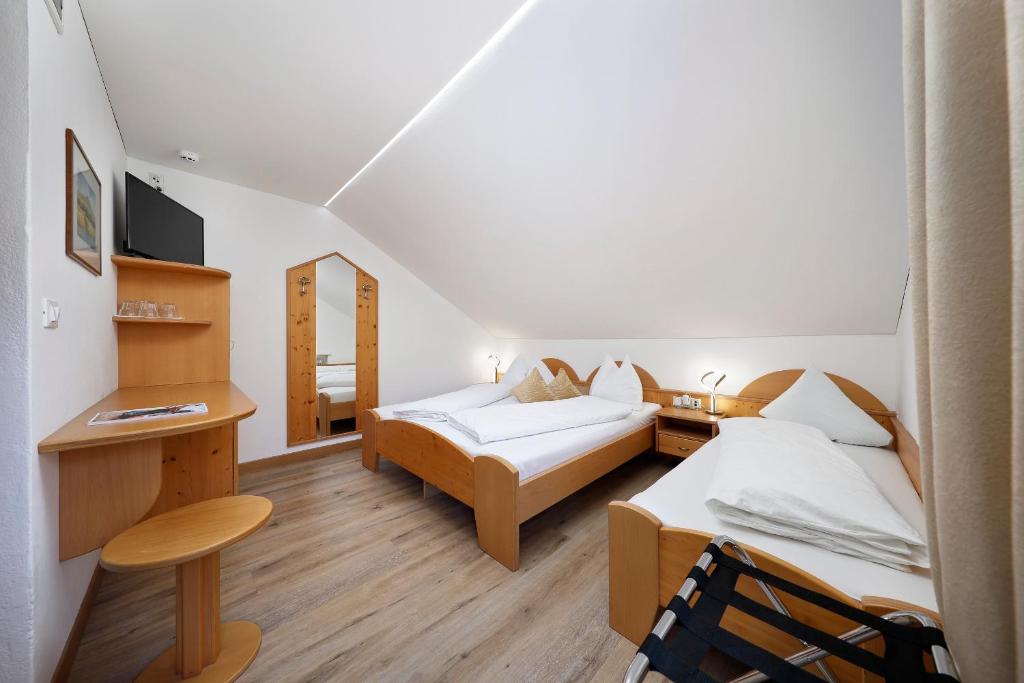 Postel nebo postele na pokoji v ubytování Hotel Unterrain