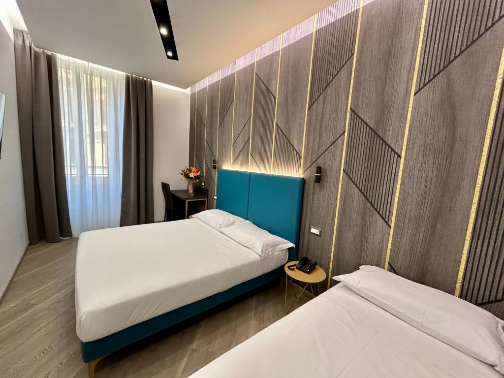 Postel nebo postele na pokoji v ubytování Hotel Contilia