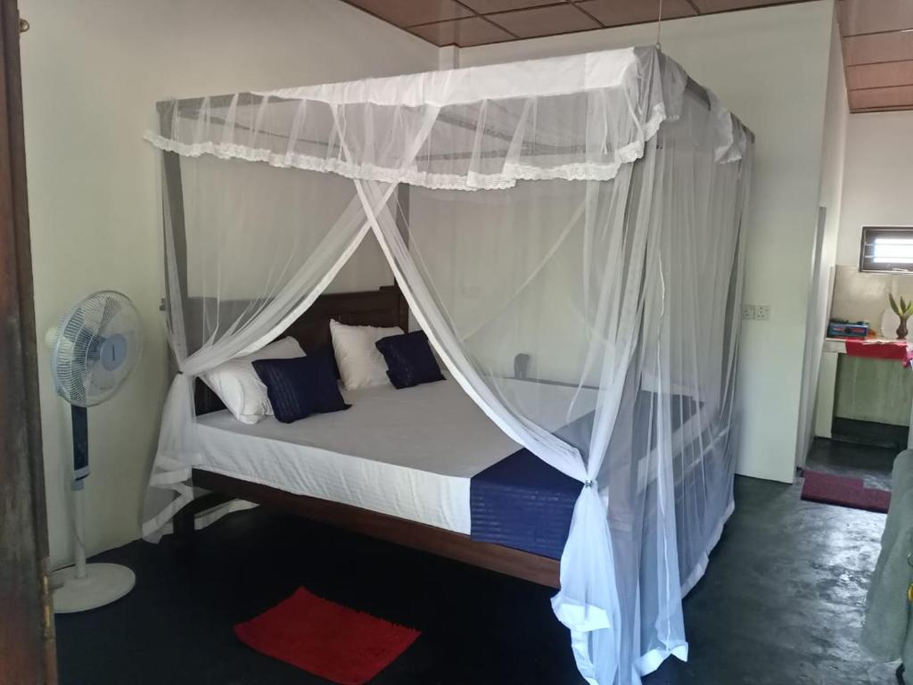 Postel nebo postele na pokoji v ubytování Venus Inn Goyambokka