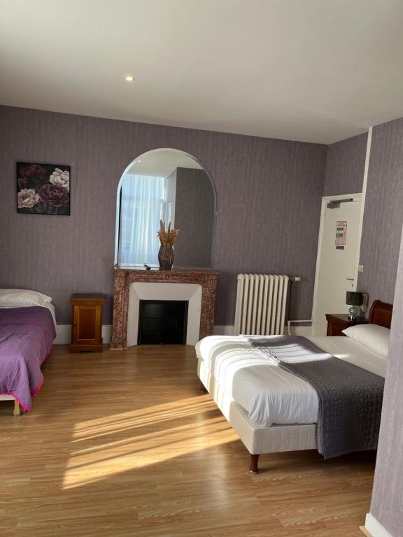 Postel nebo postele na pokoji v ubytování Hotel LE BEAU SITE