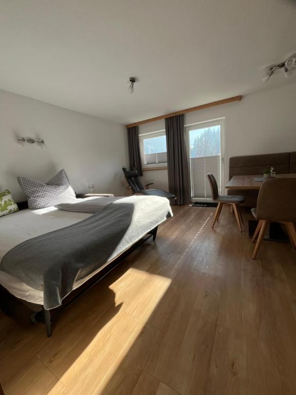 Postel nebo postele na pokoji v ubytování Sagebruenndle Appartements