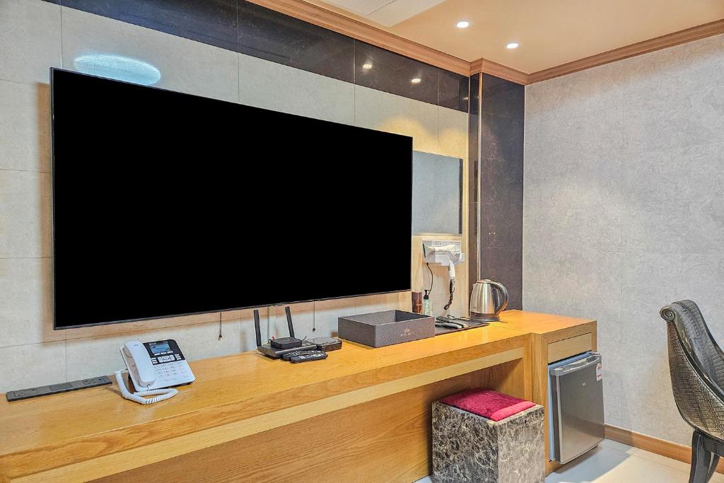 TV a/nebo společenská místnost v ubytování Hotel Unity