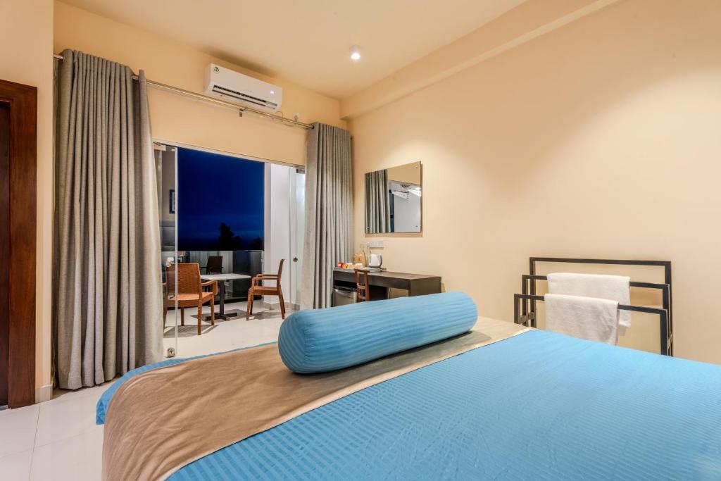 Postel nebo postele na pokoji v ubytování Mzion Hotel Weligama