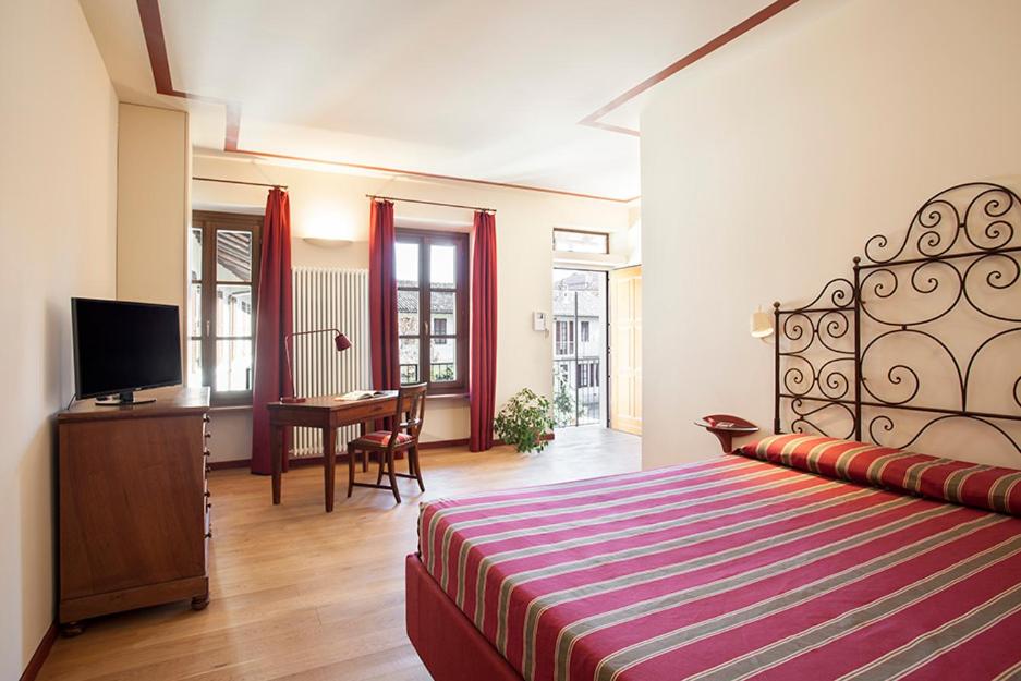 Postel nebo postele na pokoji v ubytování Borromeo Rooms Bed & Living