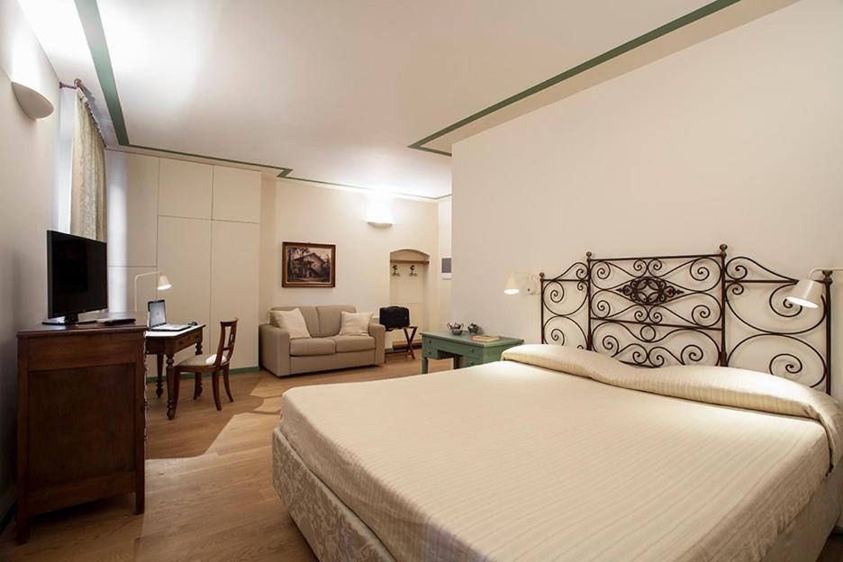 Lova arba lovos apgyvendinimo įstaigoje Borromeo Rooms Bed & Living