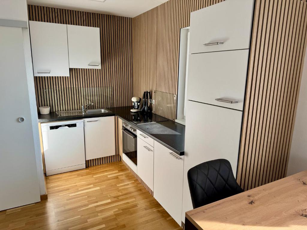Kuchyň nebo kuchyňský kout v ubytování Goldeck View Apartment