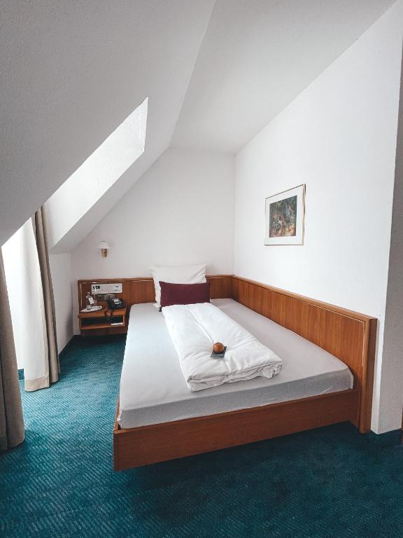 Postel nebo postele na pokoji v ubytování Hotel Tillmanns