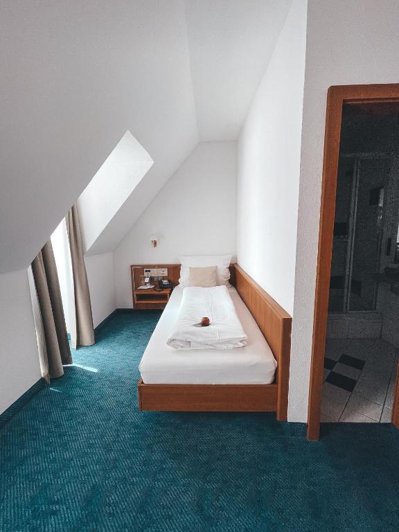 Postel nebo postele na pokoji v ubytování Hotel Tillmanns
