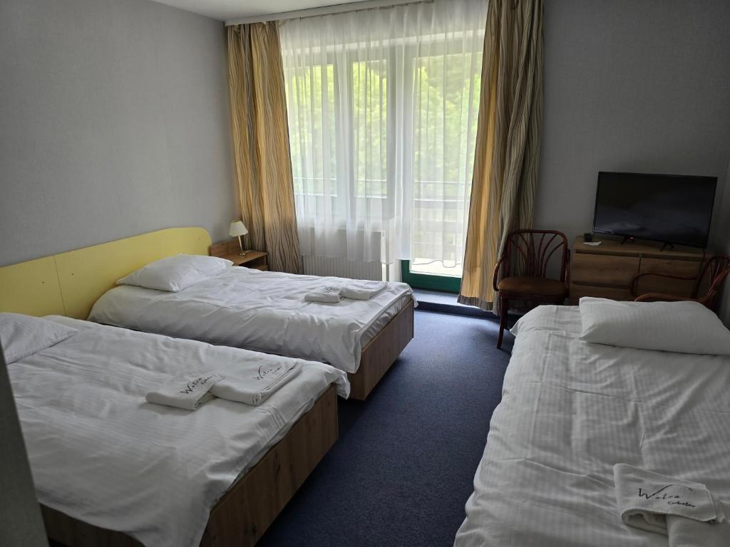 Postel nebo postele na pokoji v ubytování Ośrodek Wypoczynkowy Watra