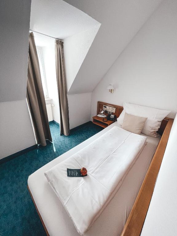 Postel nebo postele na pokoji v ubytování Hotel Tillmanns