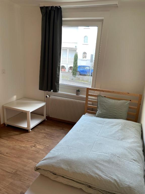Postel nebo postele na pokoji v ubytování Charmante Ferienwohnung im Oberthurgau