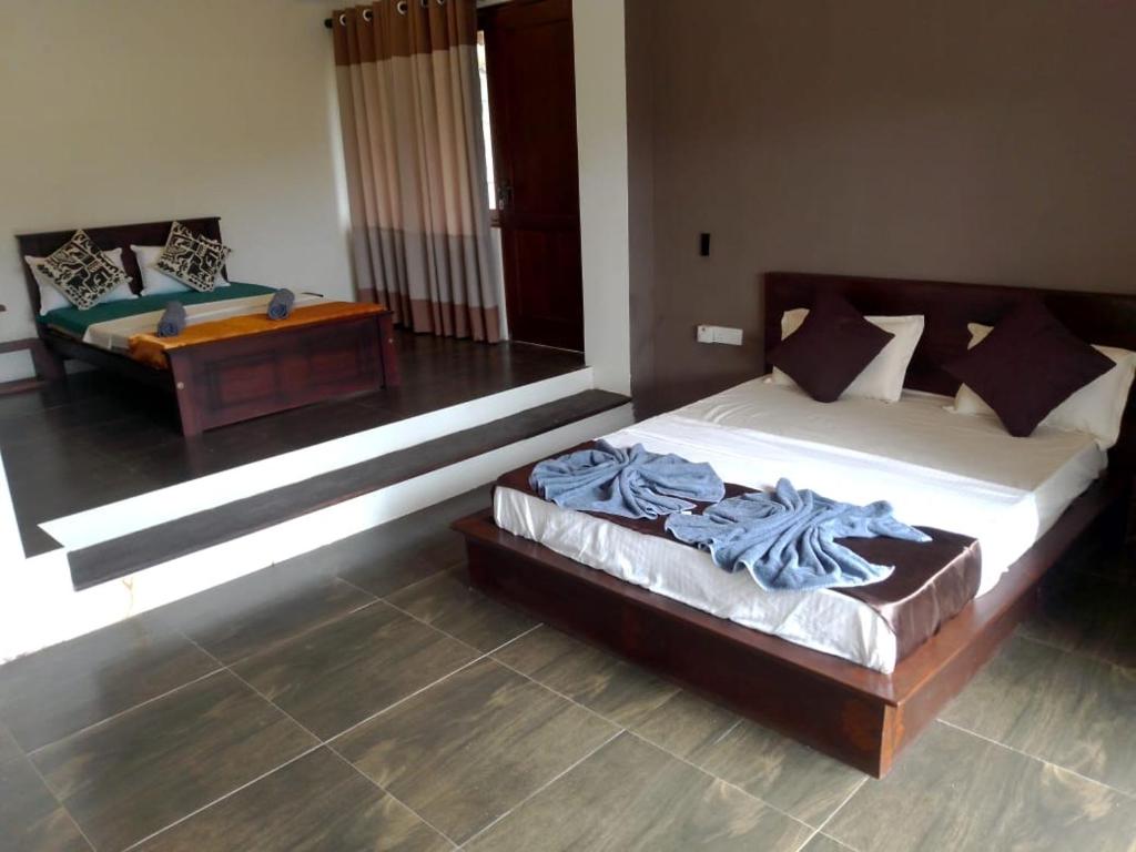 Postel nebo postele na pokoji v ubytování Riverdale Ridge Homestay