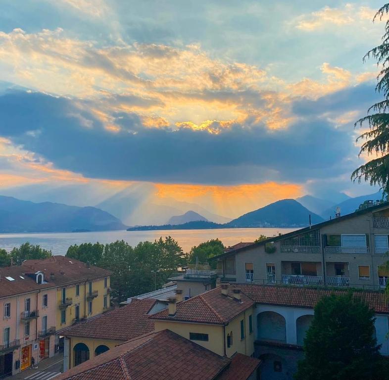 a view of the lake from a city at sunset at La casa di Alberto lake view in Laveno