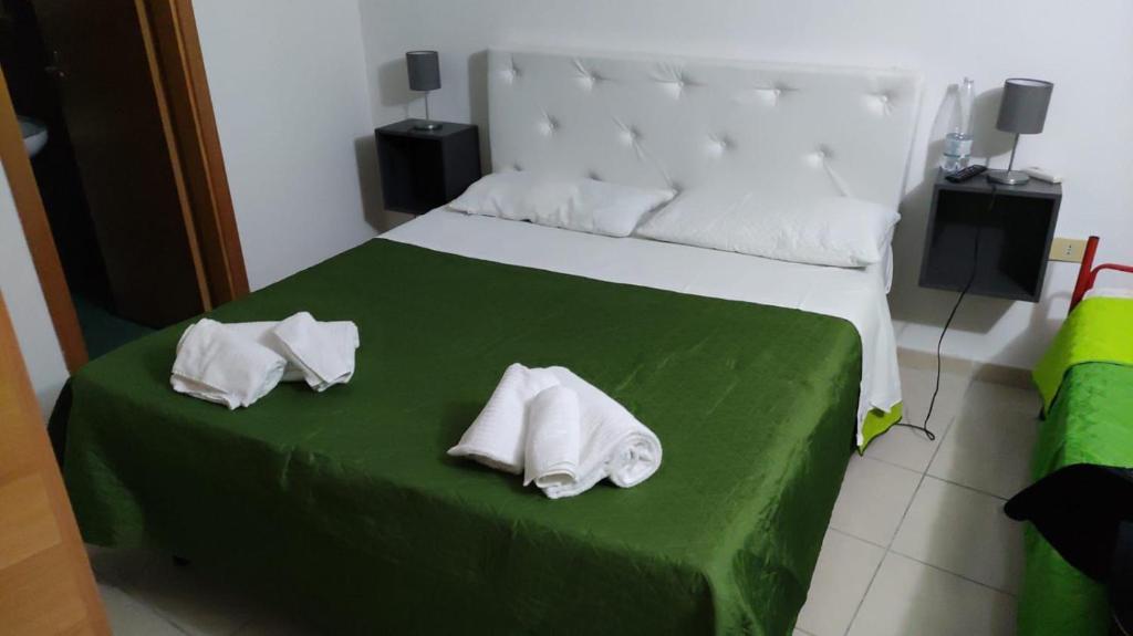 Postel nebo postele na pokoji v ubytování Residence Punta Cilento
