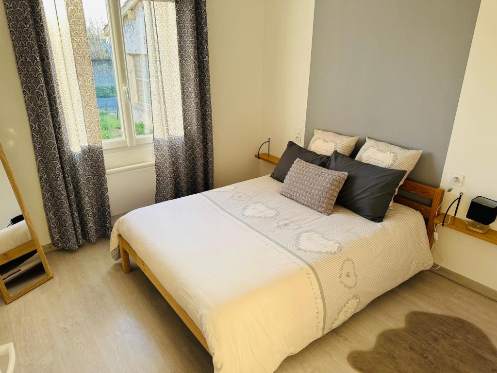 Postel nebo postele na pokoji v ubytování La Maison Jumelle ELM Tonneins