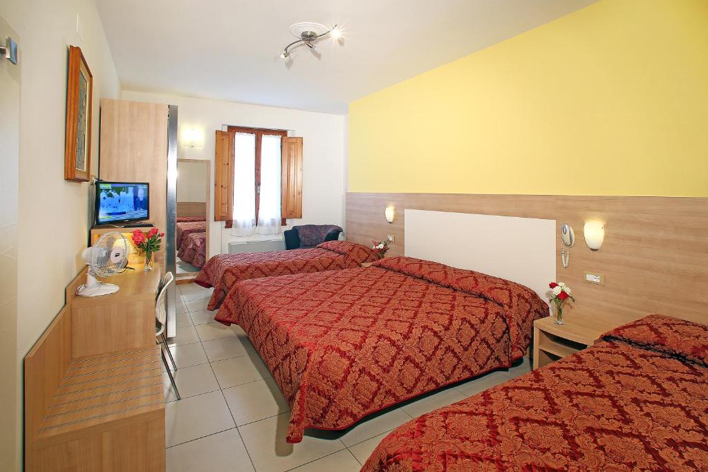 Postel nebo postele na pokoji v ubytování Hotel Marrani
