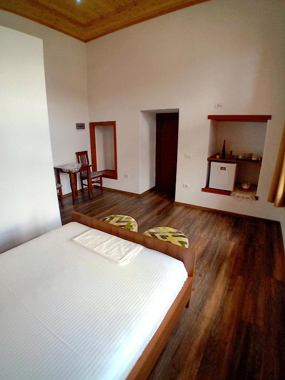 A bed or beds in a room at House H Çela