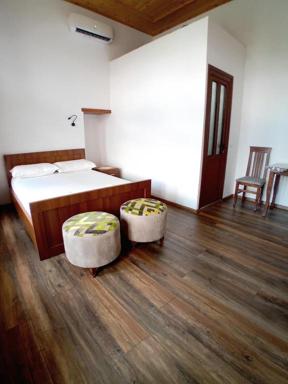 A bed or beds in a room at House H Çela