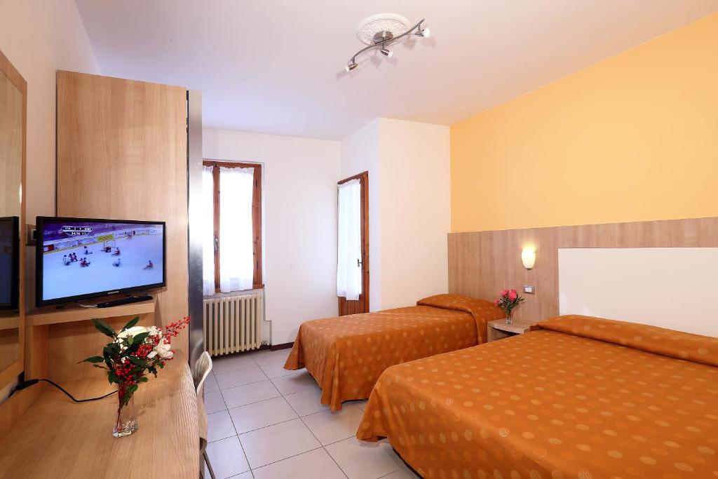 Postel nebo postele na pokoji v ubytování Hotel Marrani