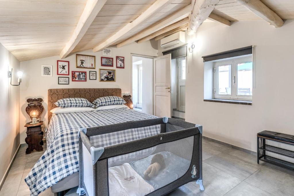 A bed or beds in a room at Circo Massimo Apartment & Terrace