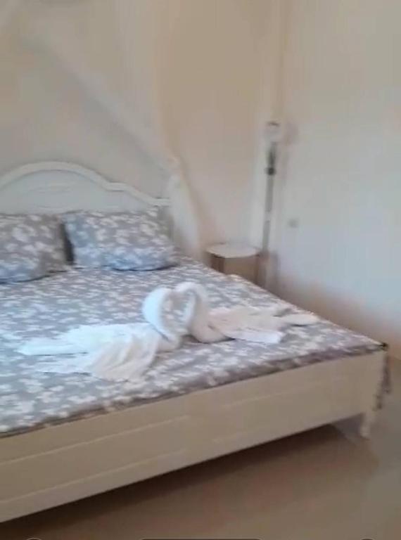 Postel nebo postele na pokoji v ubytování ขุนโลหะ