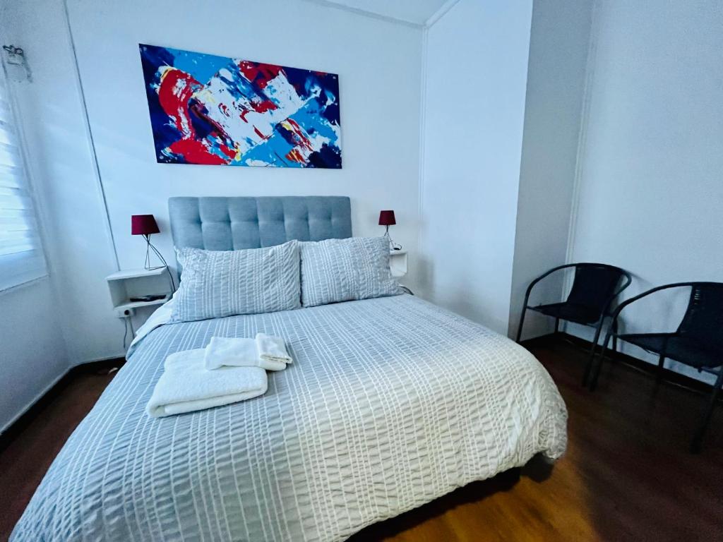 Postel nebo postele na pokoji v ubytování Hotel Nomada Osorno