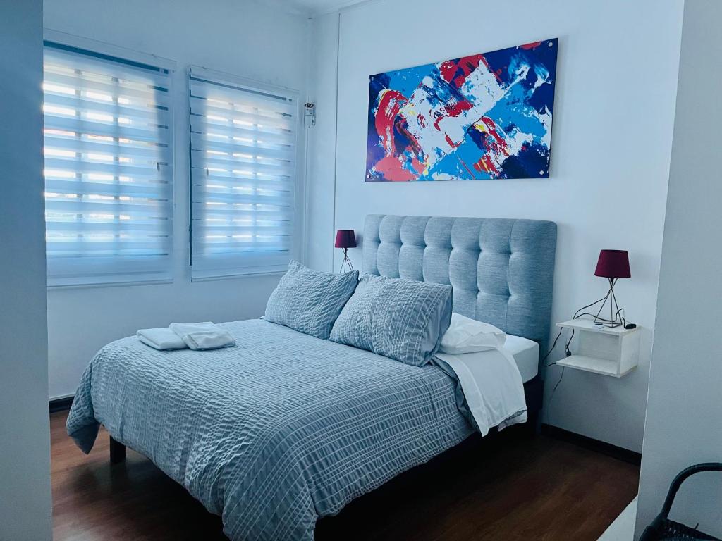Postel nebo postele na pokoji v ubytování Hotel Nomada Osorno