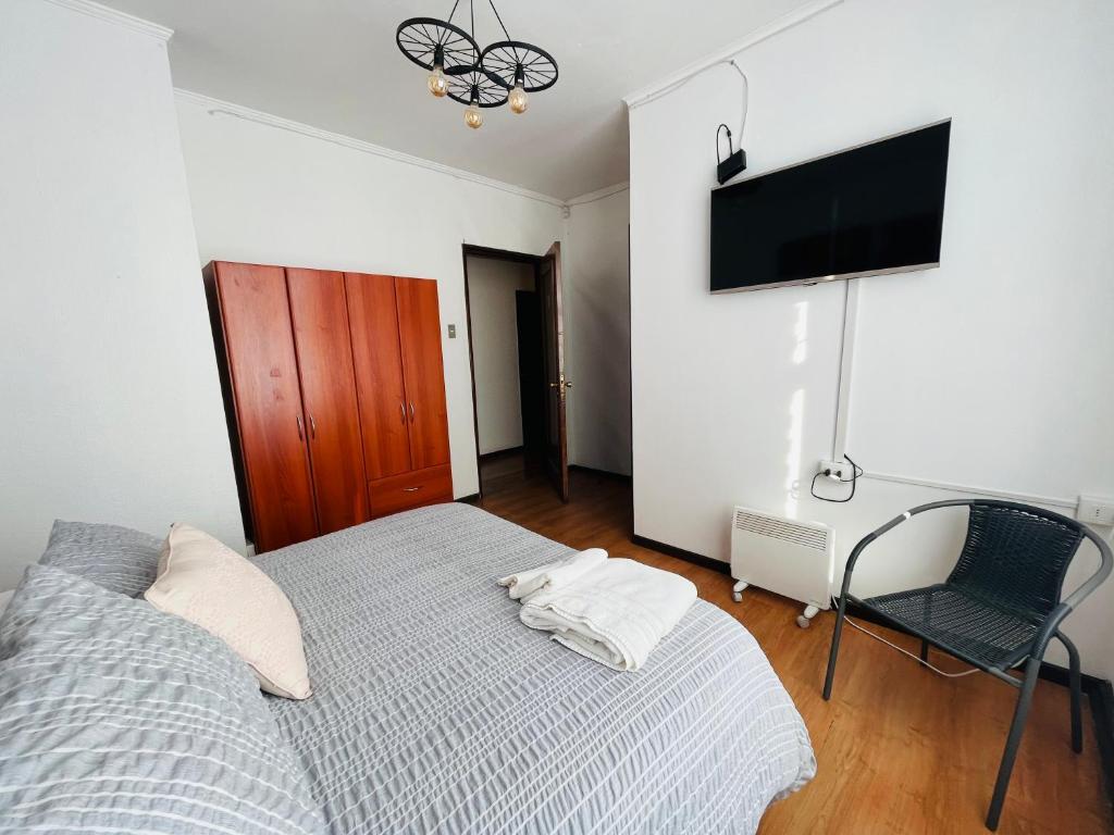 Postel nebo postele na pokoji v ubytování Hotel Nomada Osorno