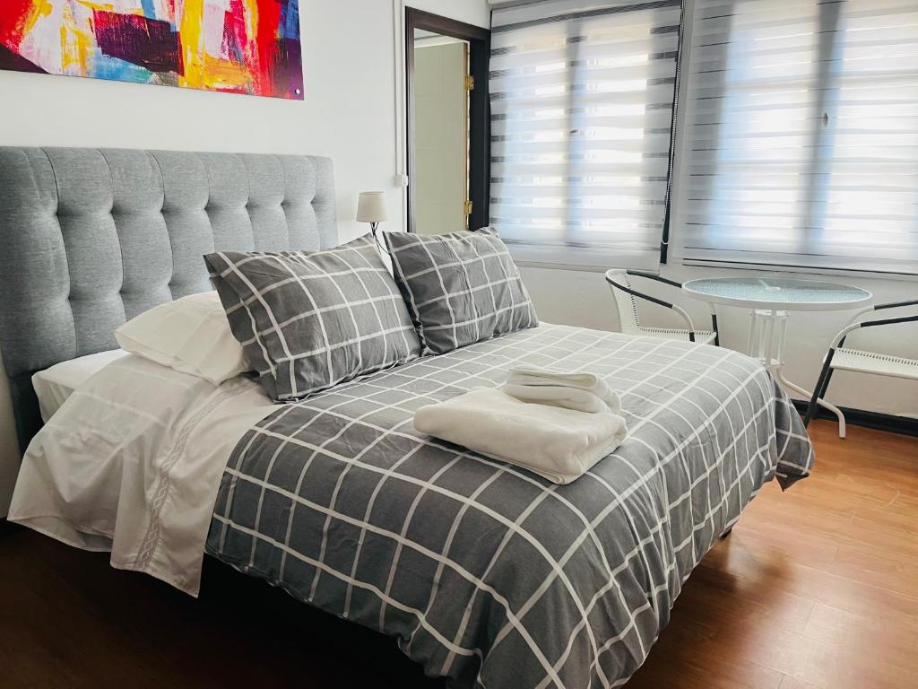 Postel nebo postele na pokoji v ubytování Hotel Nomada Osorno