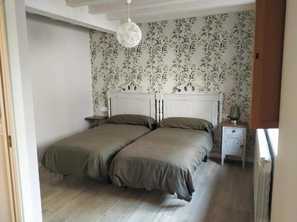 Postel nebo postele na pokoji v ubytování La Casa de las Tinas