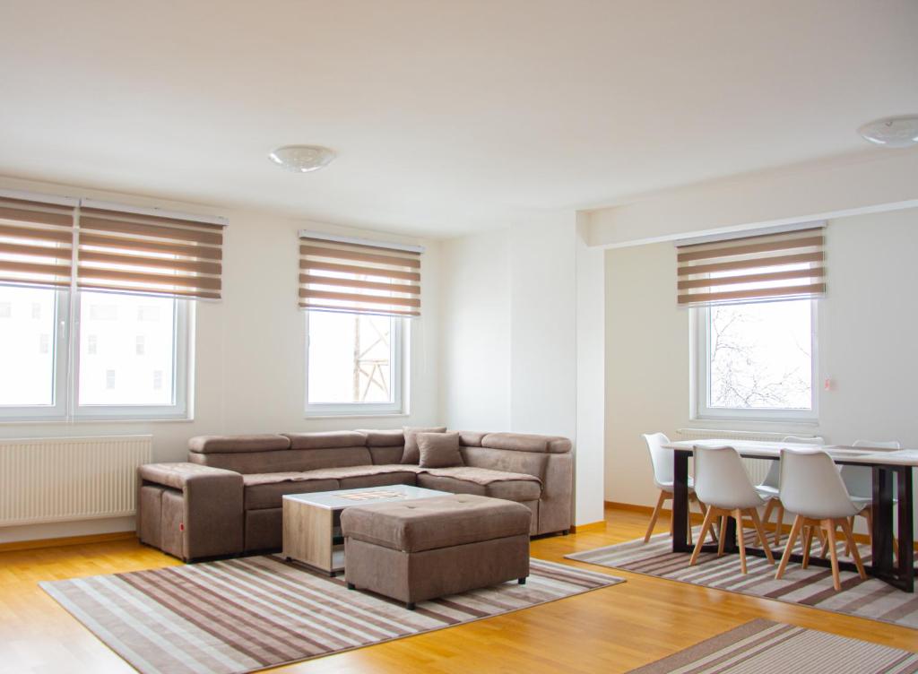 a living room with a couch and a table at Sarajevo Gate in Sarajevo