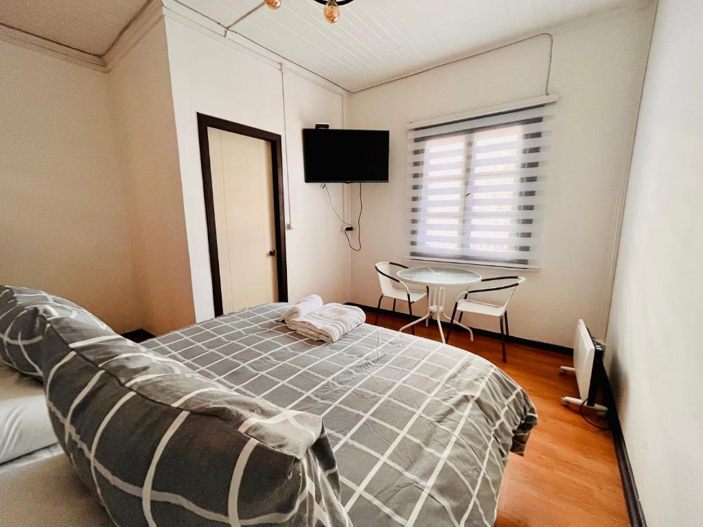 Postel nebo postele na pokoji v ubytování Hotel Nomada Osorno