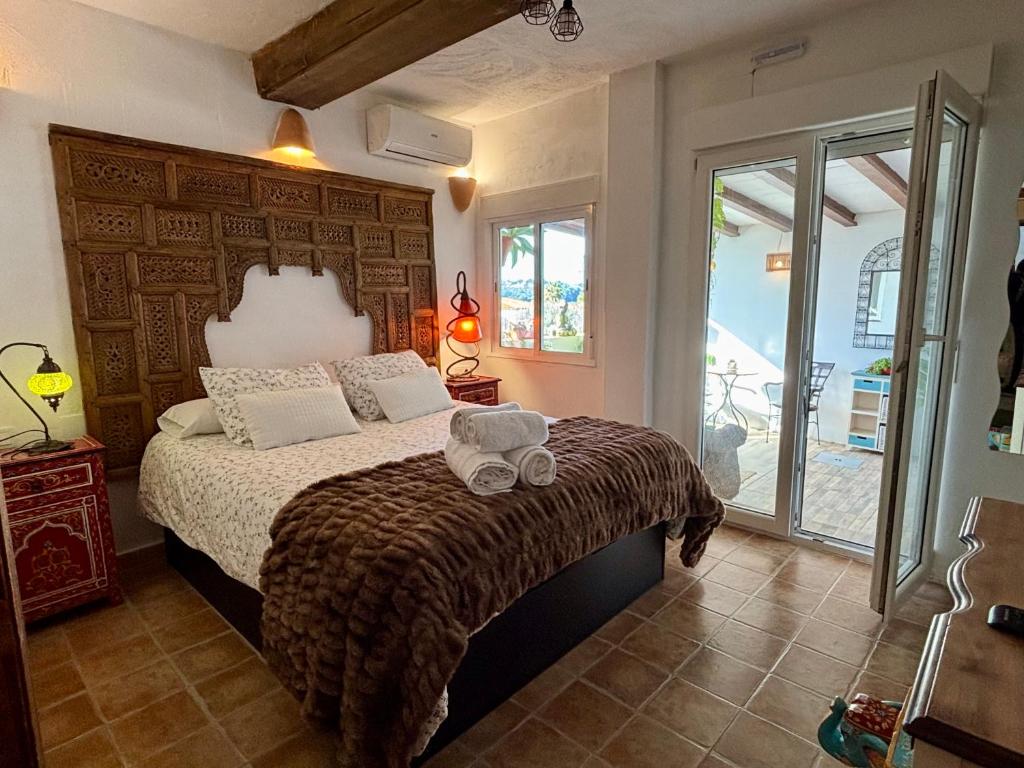 a bedroom with a bed with a large wooden headboard at Hotel Altea Paradise 1917 - Adults Only in Altea