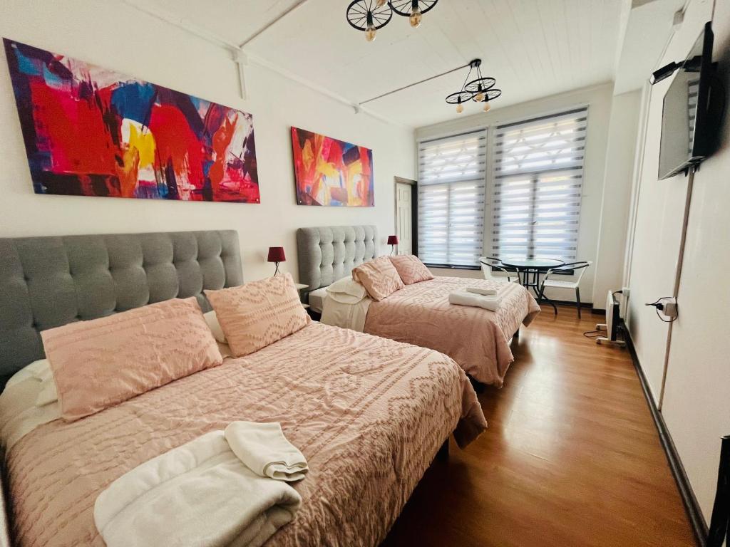 Postel nebo postele na pokoji v ubytování Hotel Nomada Osorno