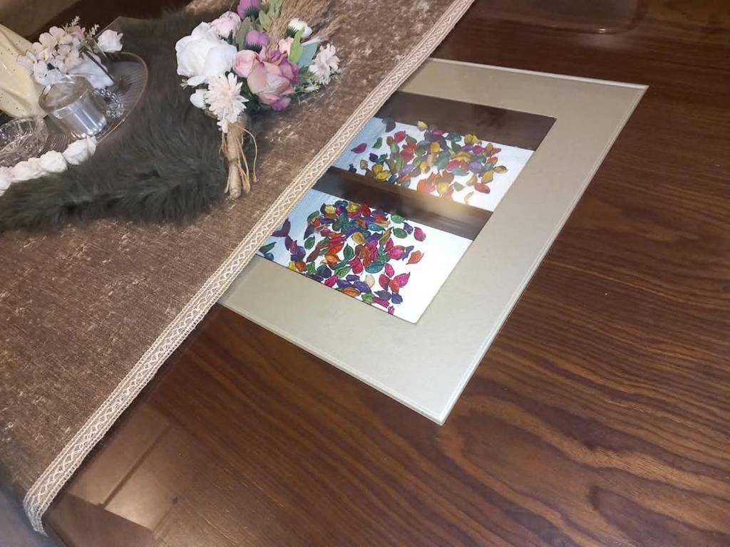 a table with two pictures on top of it at العاصمة الإدارية in Cairo