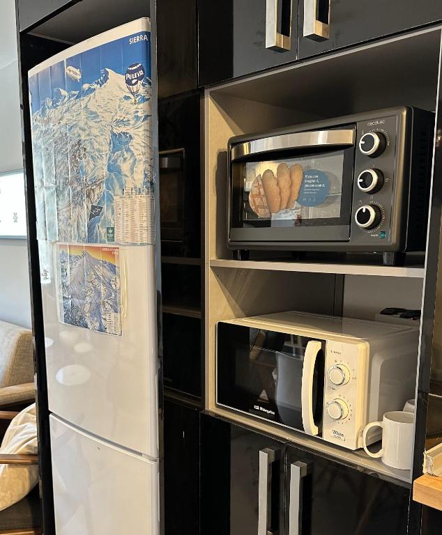 A kitchen or kitchenette at Sierra Nevada Hostel