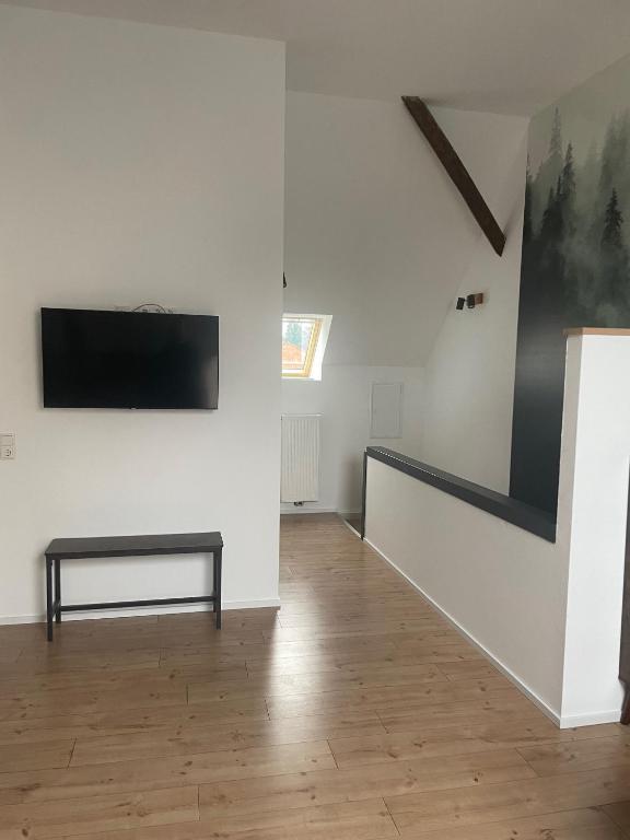 TV a/nebo společenská místnost v ubytování FREIGEIST Rooms