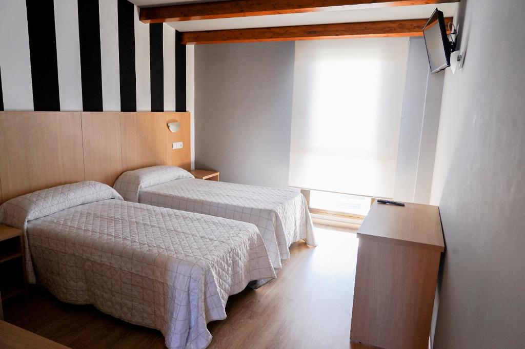 Postel nebo postele na pokoji v ubytování Área 202