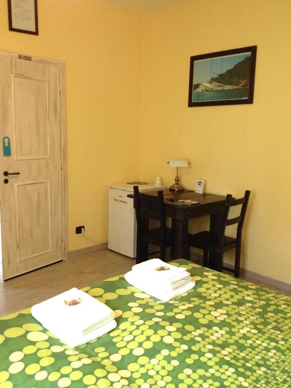 Postel nebo postele na pokoji v ubytování B&B San Leone